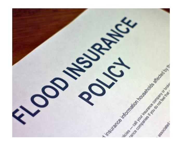 A Flood Insurance Policy On The Table